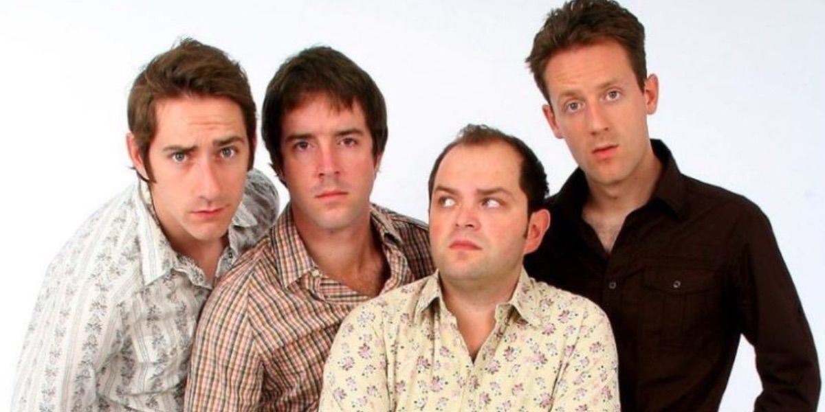 The cast of Hollow Men pose in front of a white background 