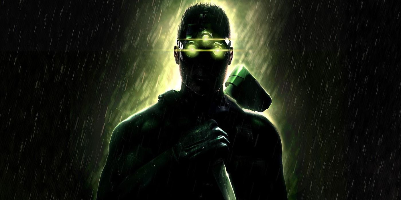 Sam Fisher holding a knife in the shadows, illuminated by his night goggles.