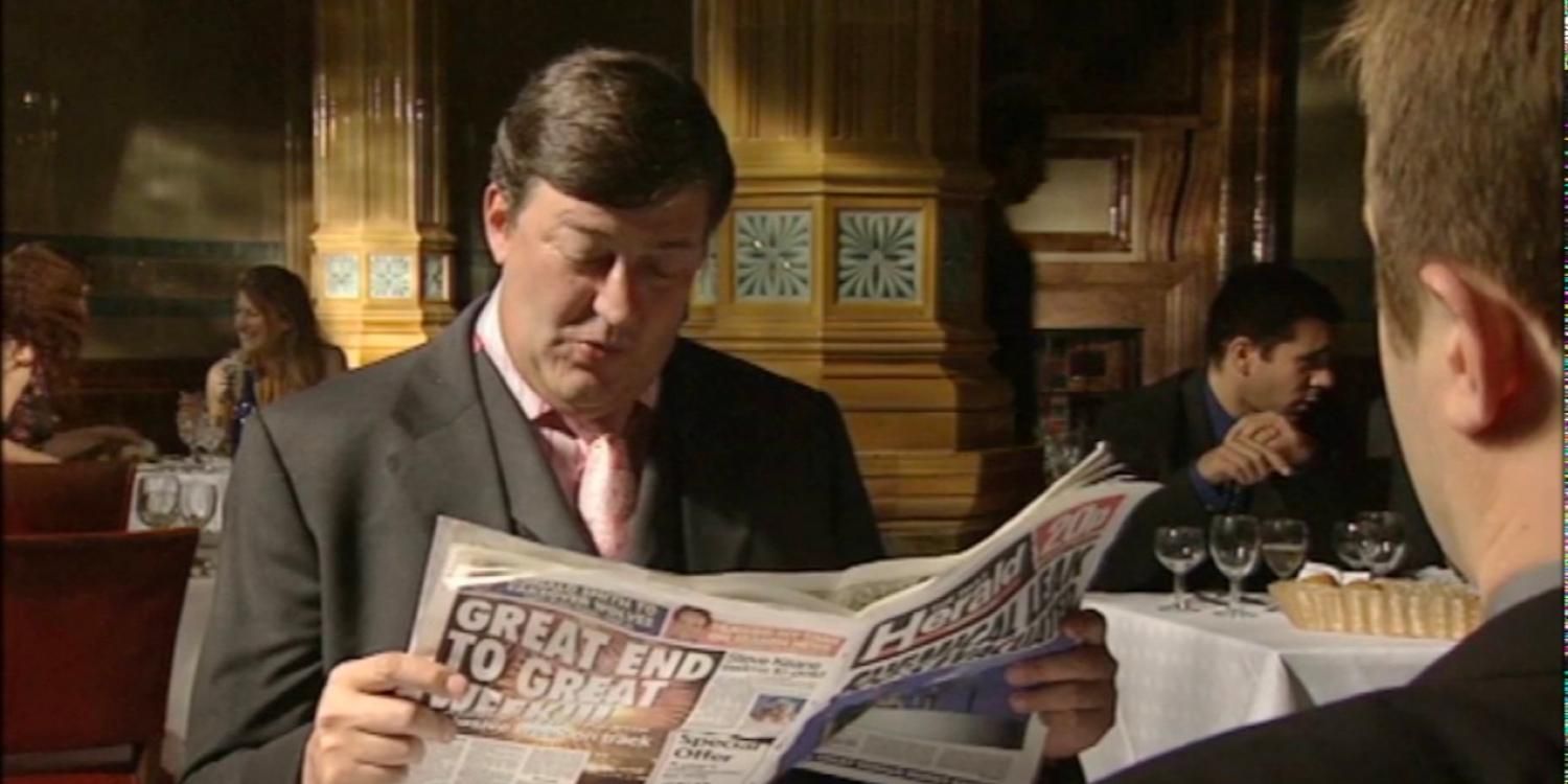 Stephen Fry reading the newspaper in Absolute Power