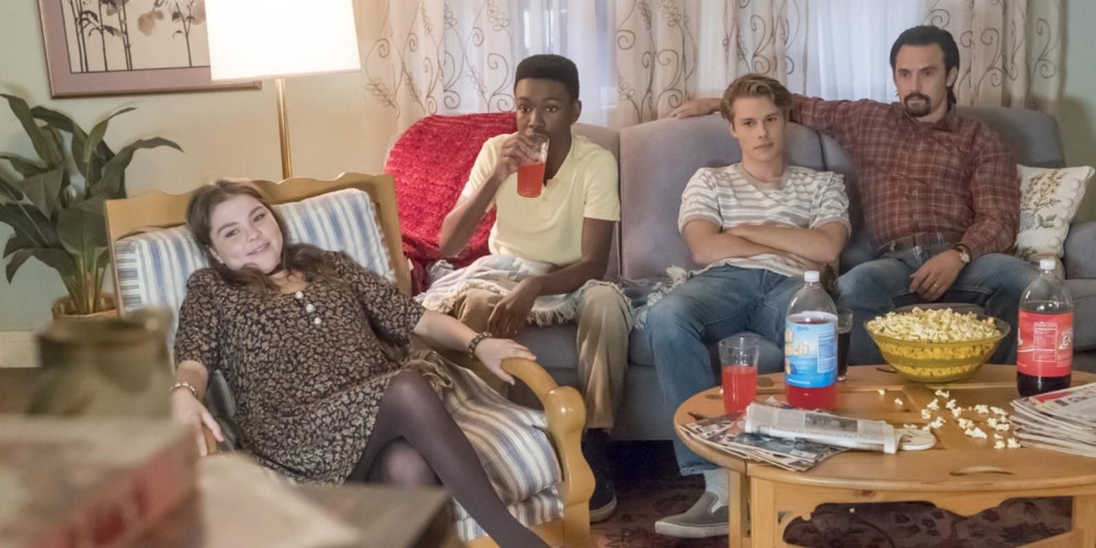 Teen Kate, Randall, and Kevin Pearson sit with their dad Jack Pearson in This Is Us