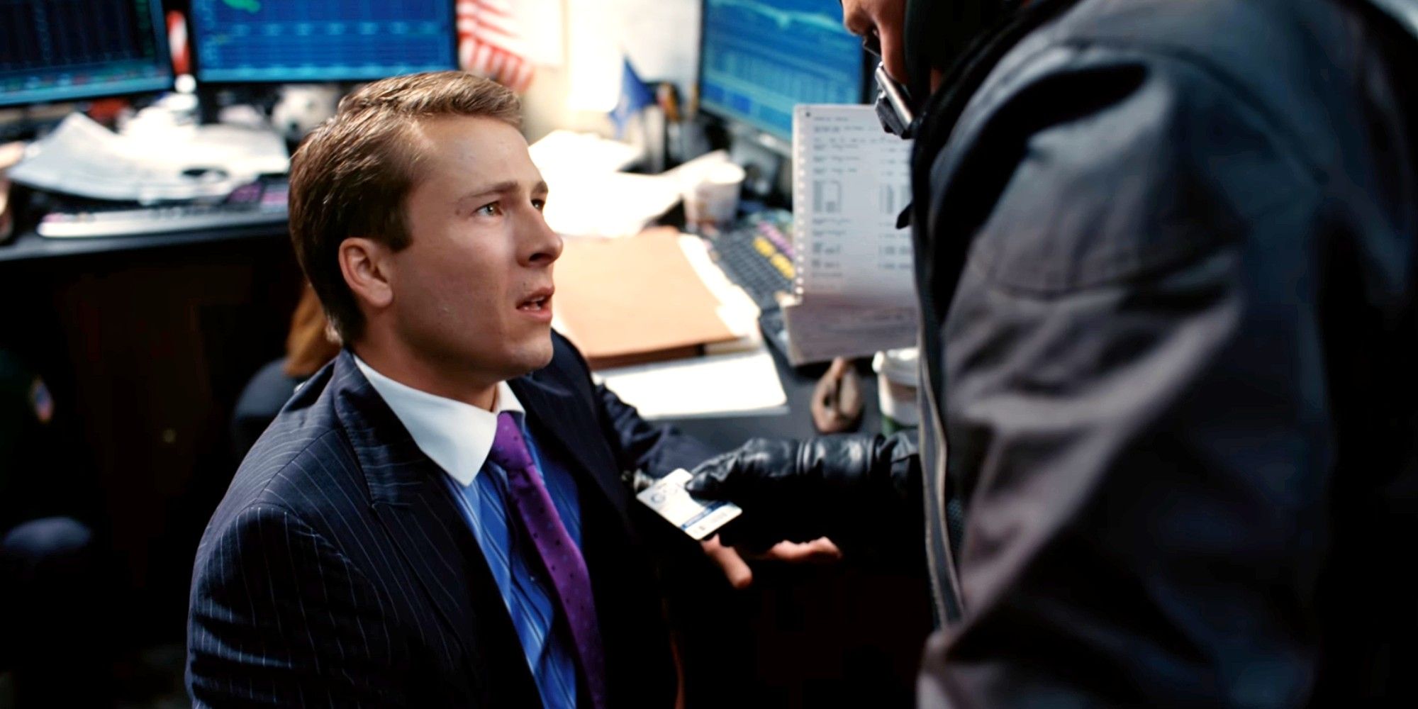 Glen Powell as a trader in The Dark Knight Rises