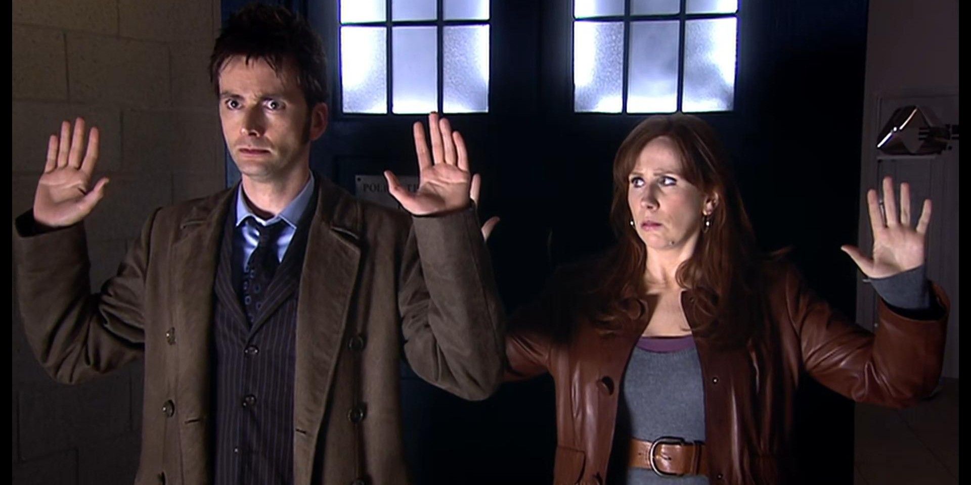 The Doctor and Donna with their hands up looking serious in Doctor Who 1