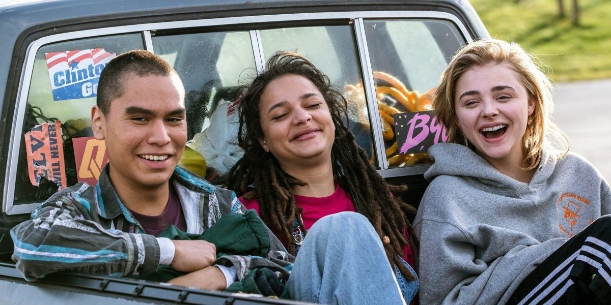 Cameron, Adam, and Jane sitting in the back of a truck in The Miseducation Of Cameron Post