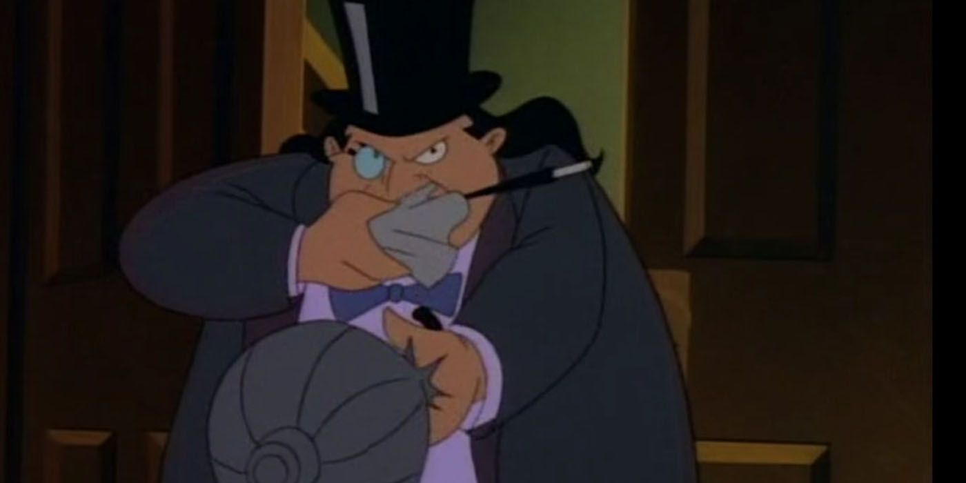 The Penguin aims his umbrella weapon in Batman The Animated Series