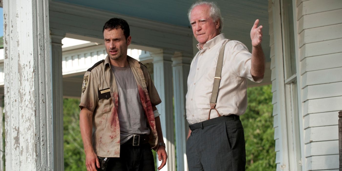 Rick and Hershel standing on a porch in TWD.