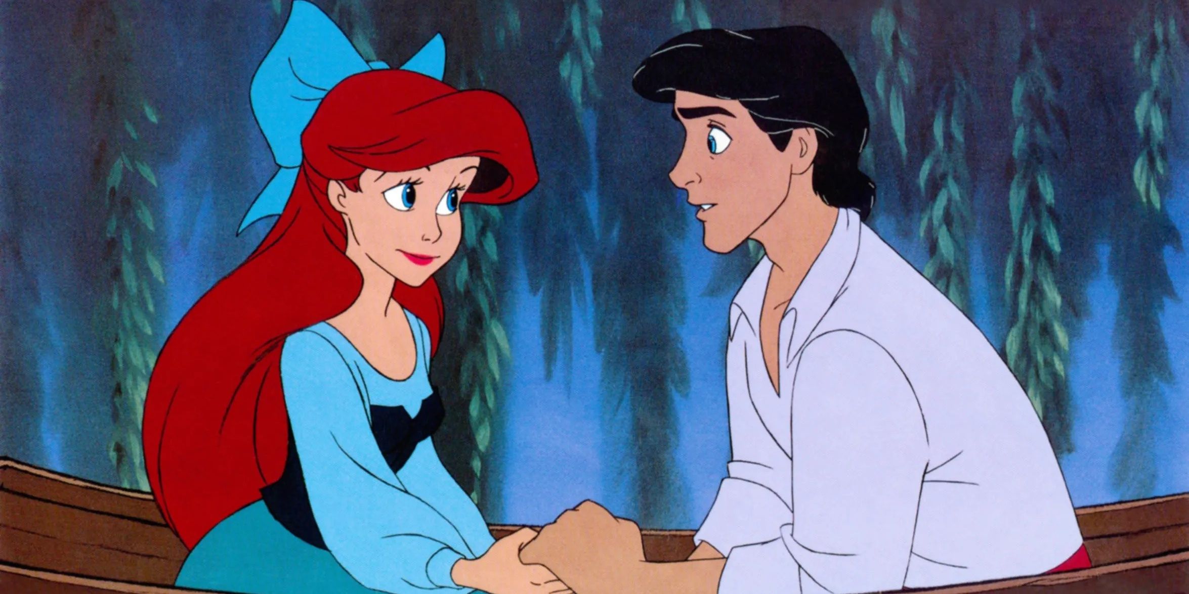 Ariel and the prince holding hands on a boat