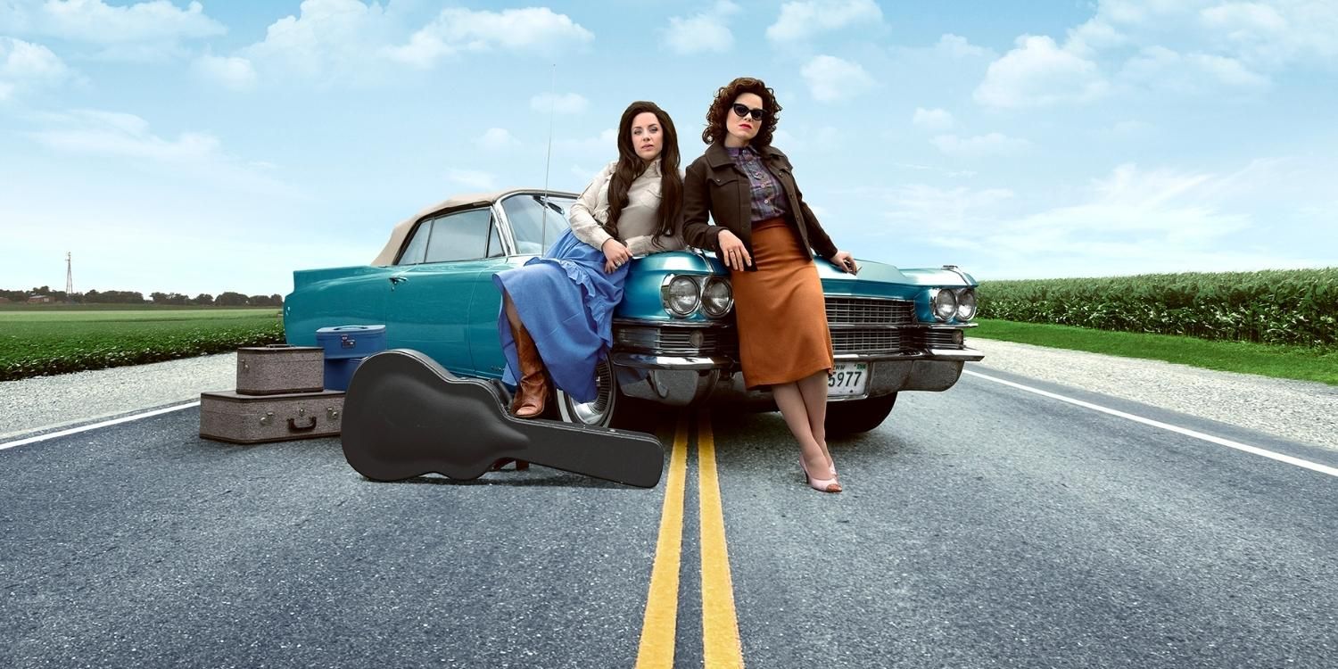 The titular characters lean on a car in Patsy &amp; Loretta
