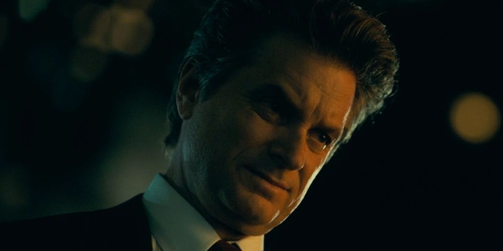 Burke looks down at night in Joker