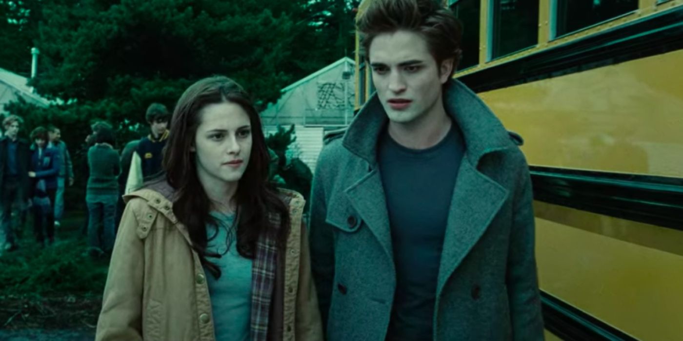 Bella and Edward walking near a school bus in Twilight