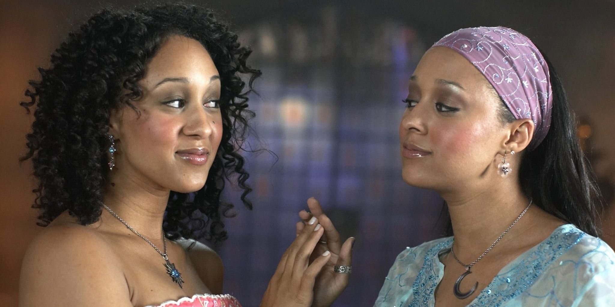 Twitches sisters high fiving each other
