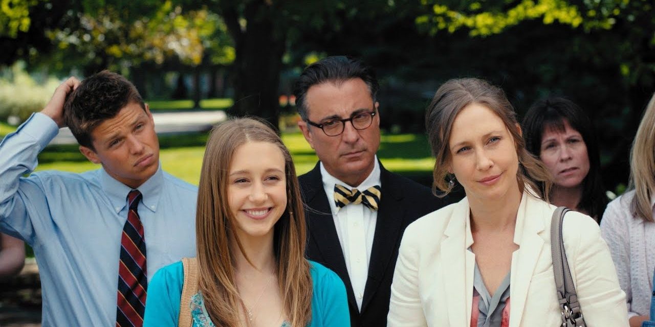 Vera and Taissa Farmiga standing in a crowd in At Middleton