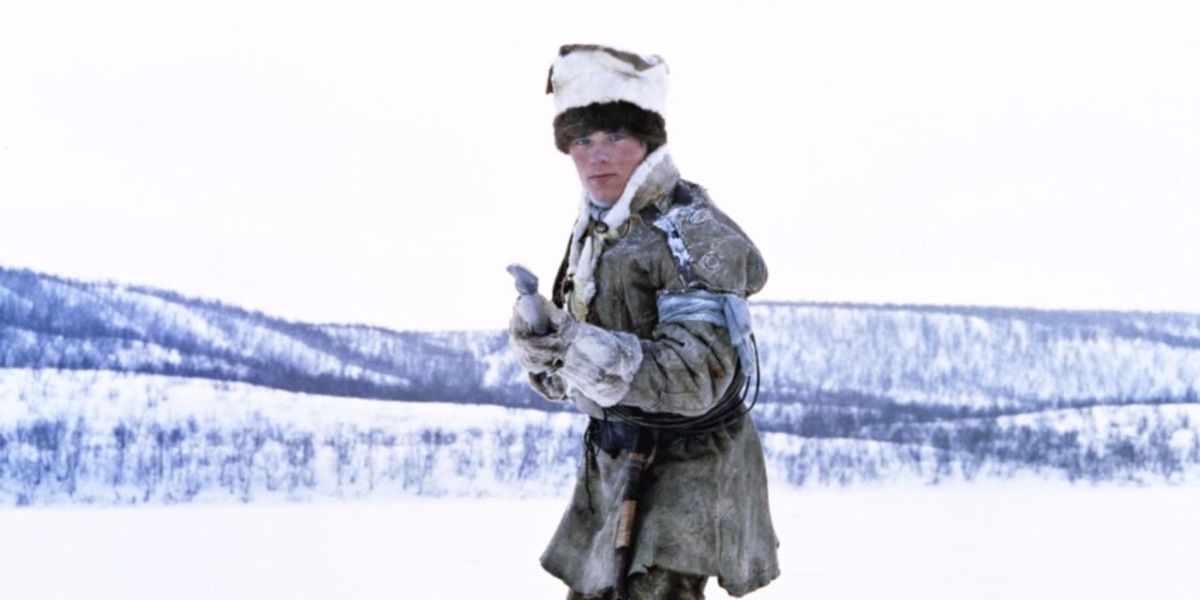 A young boy stands with a spear in the snow from Pathfinder