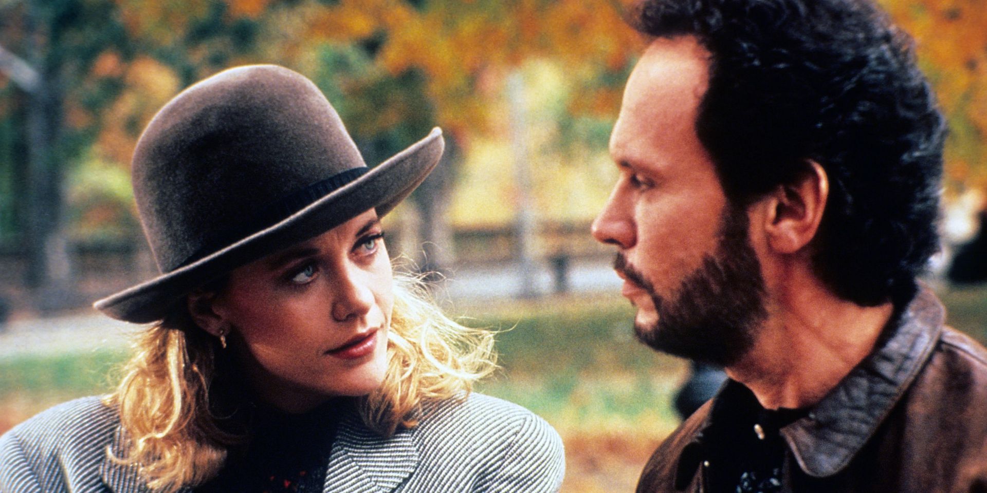 Meg Ryan and Billy Crystal in When Harry Met Sally standing together in a park probably NYC