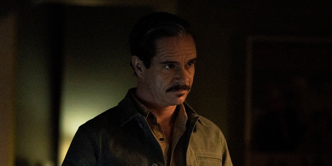 Lalo from Better Call Saul standing in the dark, looking menacing.