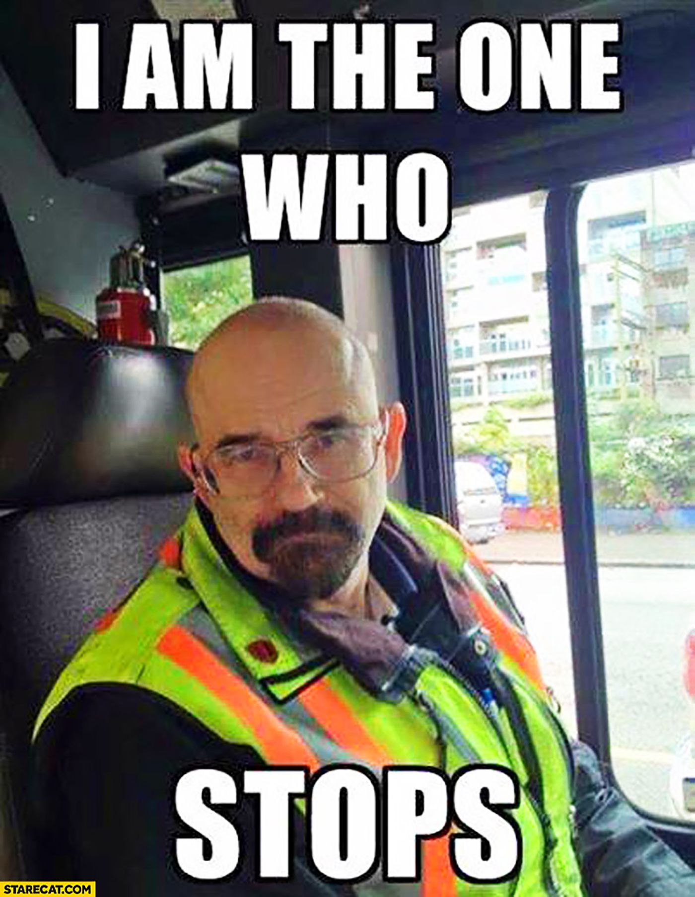 A Walter White look-a-like sitting behind a bus in a funny meme.