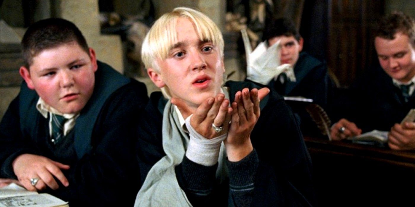 Tom Felton as Draco Malfoy sending an origami swan to Harry Potter