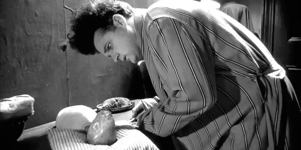 Henry examines his baby in Eraserhead