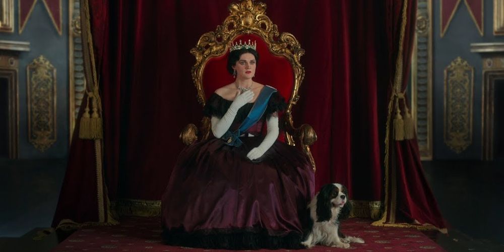 Queen Victoria sits on her throne in The Greatest Showman