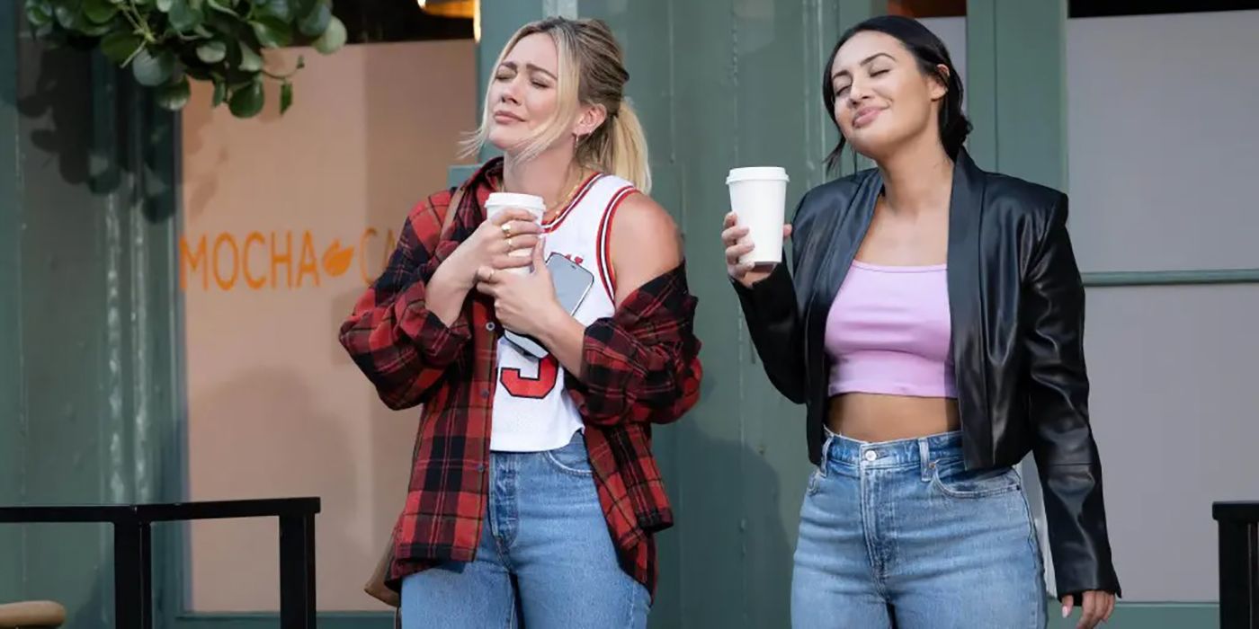 Sophie and Valentina standing outside with coffees on How I Met Your Father.
