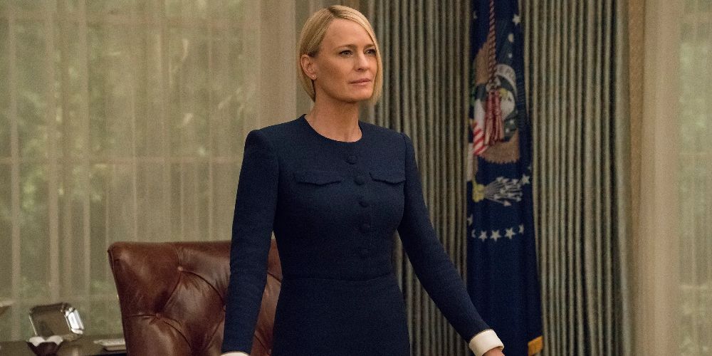 Clair stands at her desk in House of Cards