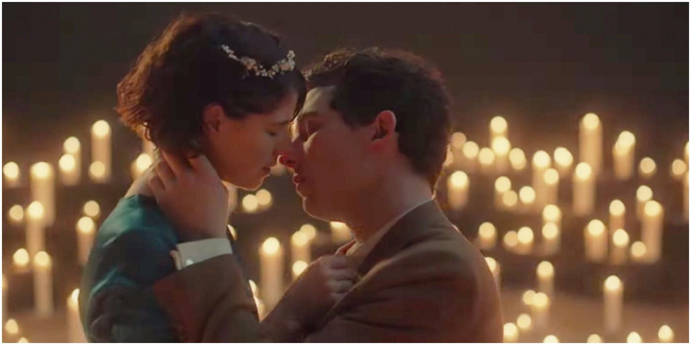 Jessie Buckley and Josh O'Connor kissing by candles in Romeo and Juliet