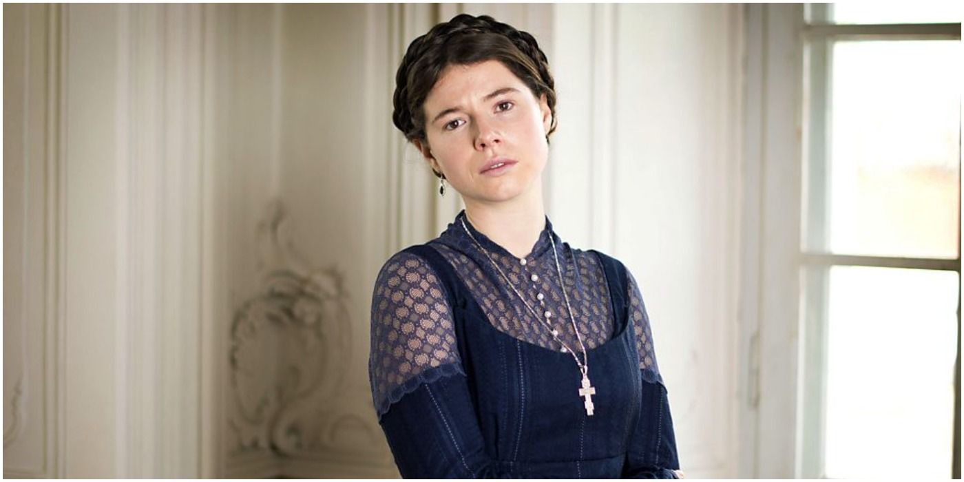 Jessie Buckley by the window in War and Peace