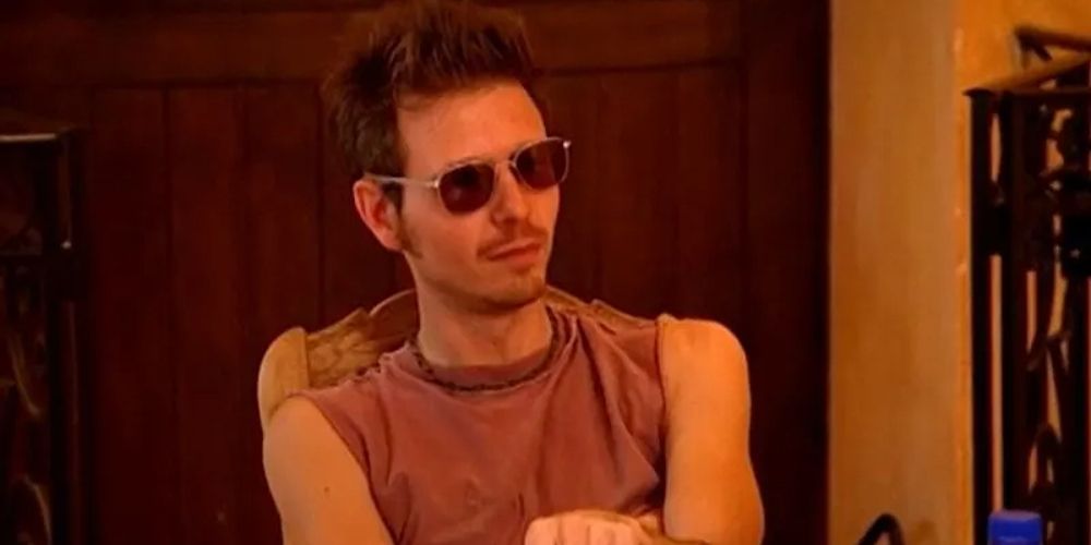 Jim sits with his arms folded on The Mole