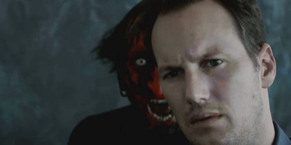 The Lipstick-Face Demon standing behind a man in Insidious