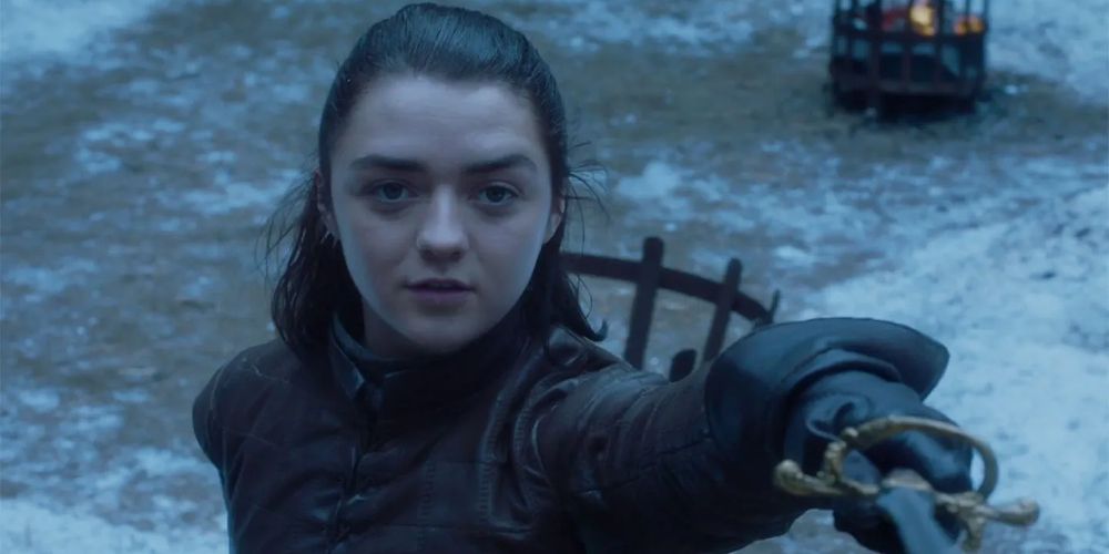 Arya holds out a sword in the snow on Game of Thrones