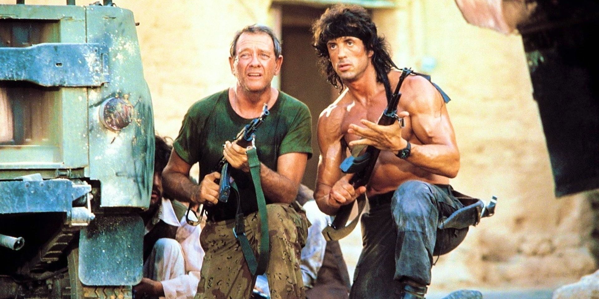 Rambo holding guns with Trautman in Rambo III