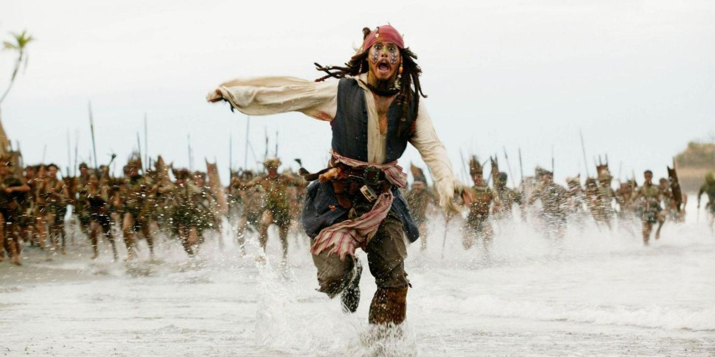 Jack running away from the cannibal tribe in Pirates of the Caribbean