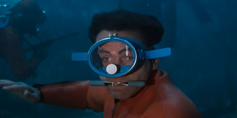 sean connery as james bond 007 uses the debreather q-branch gadget during an underwater fight scene in thunderball while an enemy with a scuba tank passes behind him