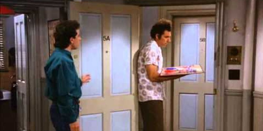 Kramer backs into Jerry's with a Risk board in Seinfeld