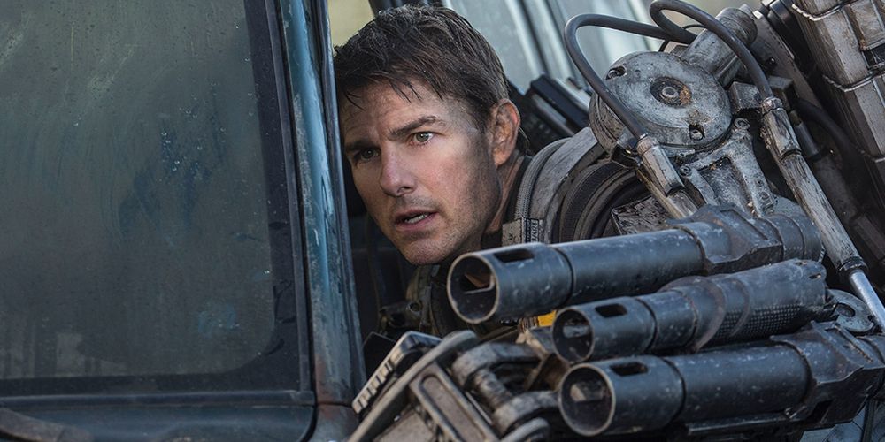 Tom Cruise uses a derelict car for cover in Edge of Tomorrow.