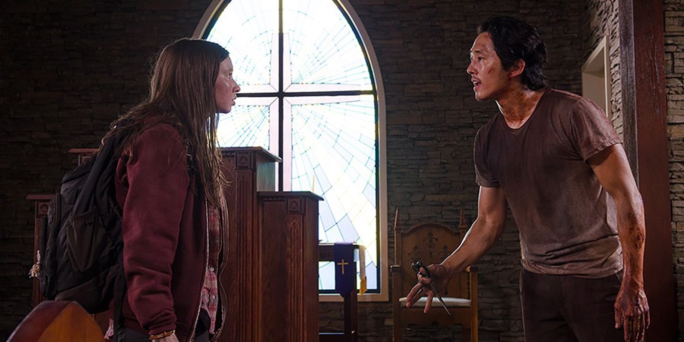 Glenn and Enid talking in a scene from The Walking Dead.