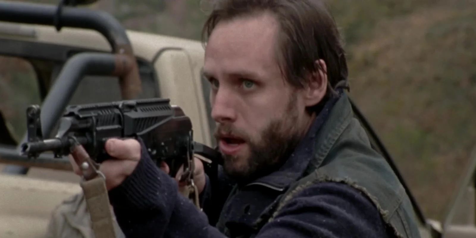 Allen points a gun in The Walking Dead