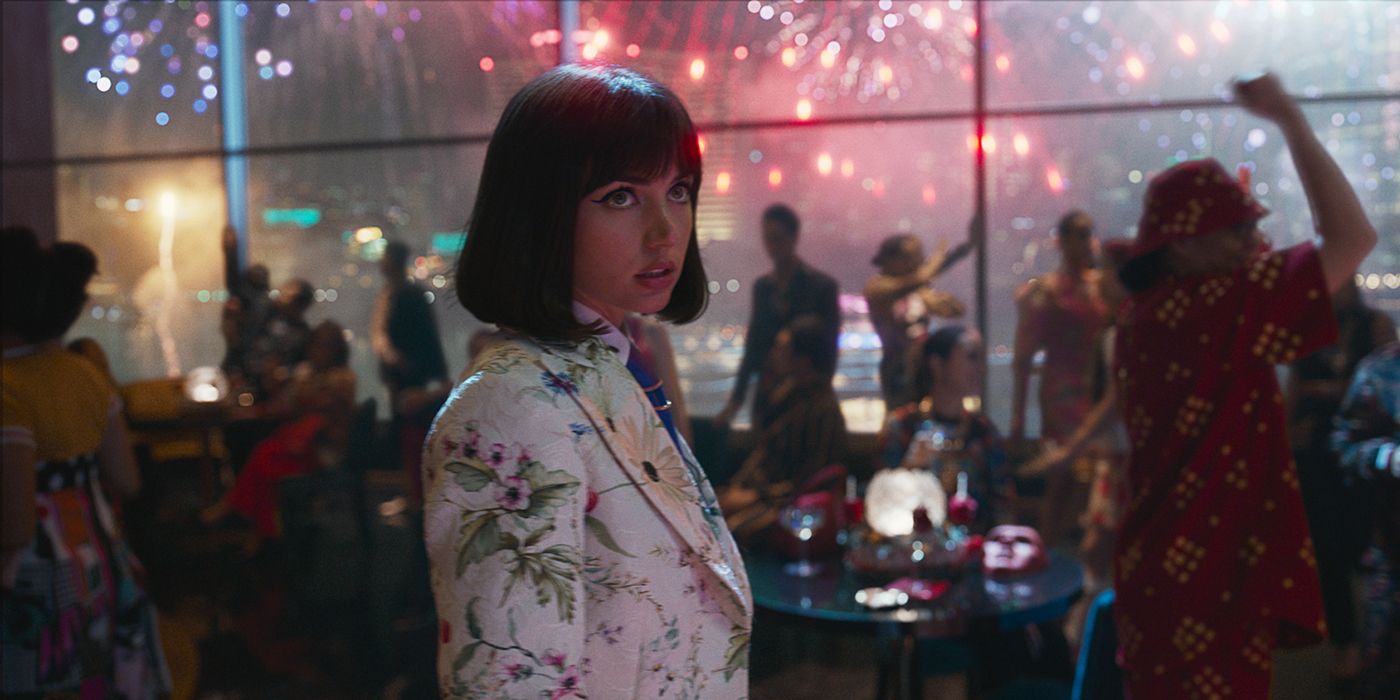 Ana de Armas surrounded by fireworks and partygoers in The Gray Man.