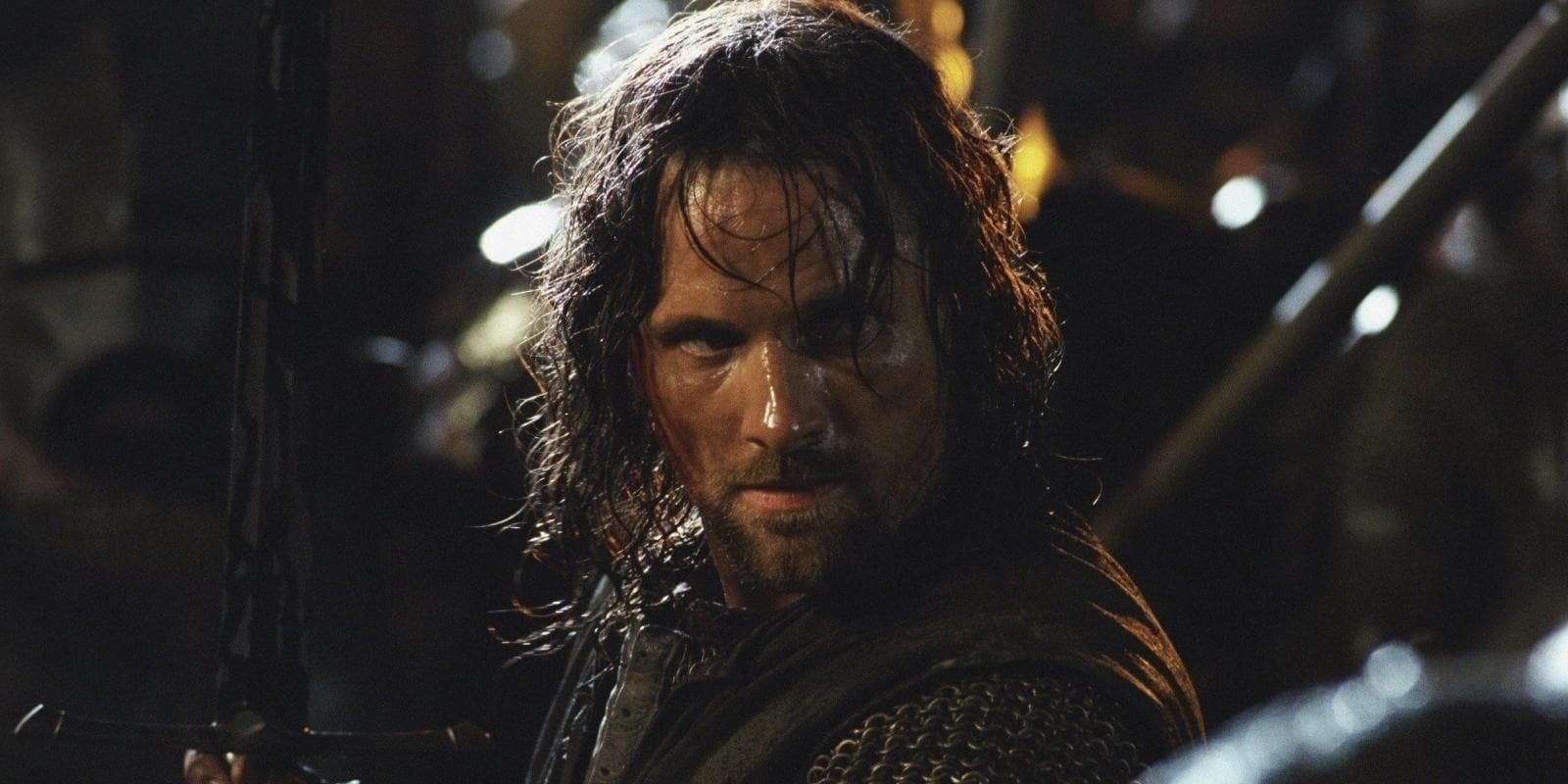 Aragorn holding his sword in The Lord of the Rings