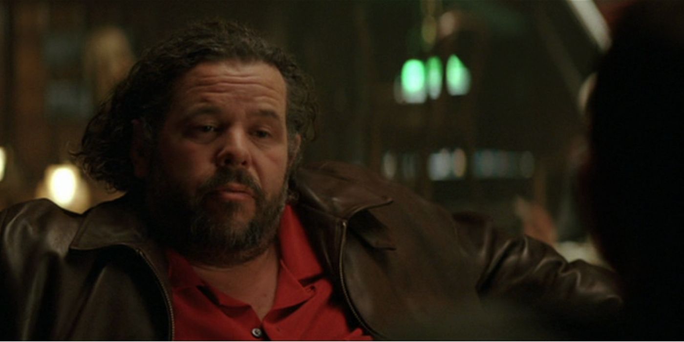Arnold in a bar in Batman Begins