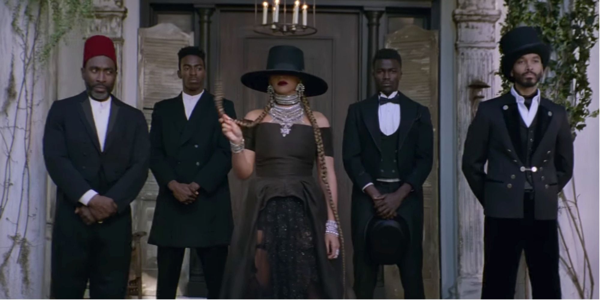 Beyoncé wearing a hat in front of a plantation house in the Formation video