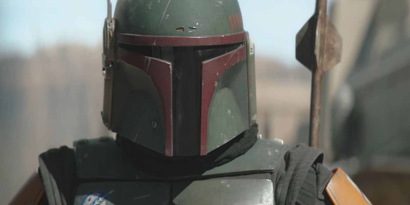 Temuera Morrison as Boba Fett in The Book of Boba Fett wearing his helmet during a showdown in the street