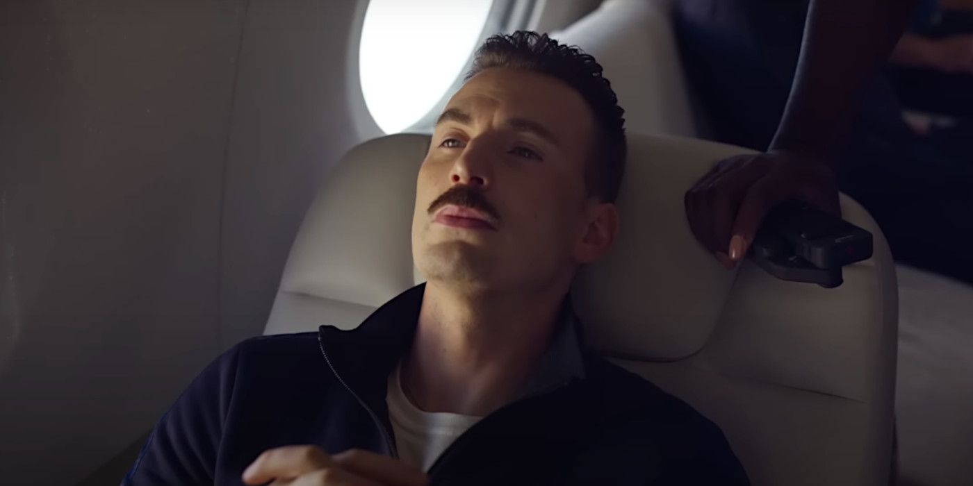 Chris Evans in character as Lloyd Hansen in The Gray Man, leaning back in his airplane seat and looking menacing