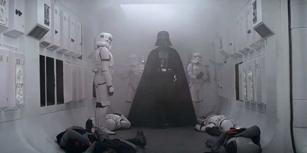Darth Vader boards Princess Leia's Rebel Blockade Runner surrounded by Stormtroopers and fallen Rebel soldiers in Star Wars A New Hope