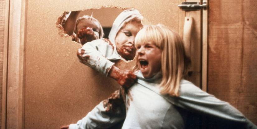 A screaming girl being pulled by a monster in David Cronenberg's The Brood