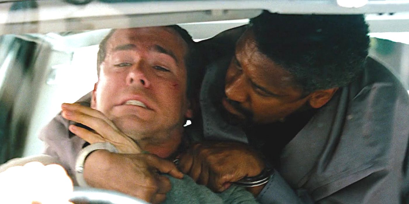 Denzel Washington holds a knife to Ryan Reynolds' throat in a scene from the movie Safe House