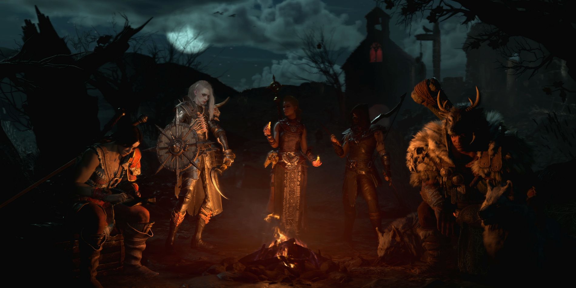 Diablo 4 art mettant en vedette une fête complète autour d'un feu de camp.