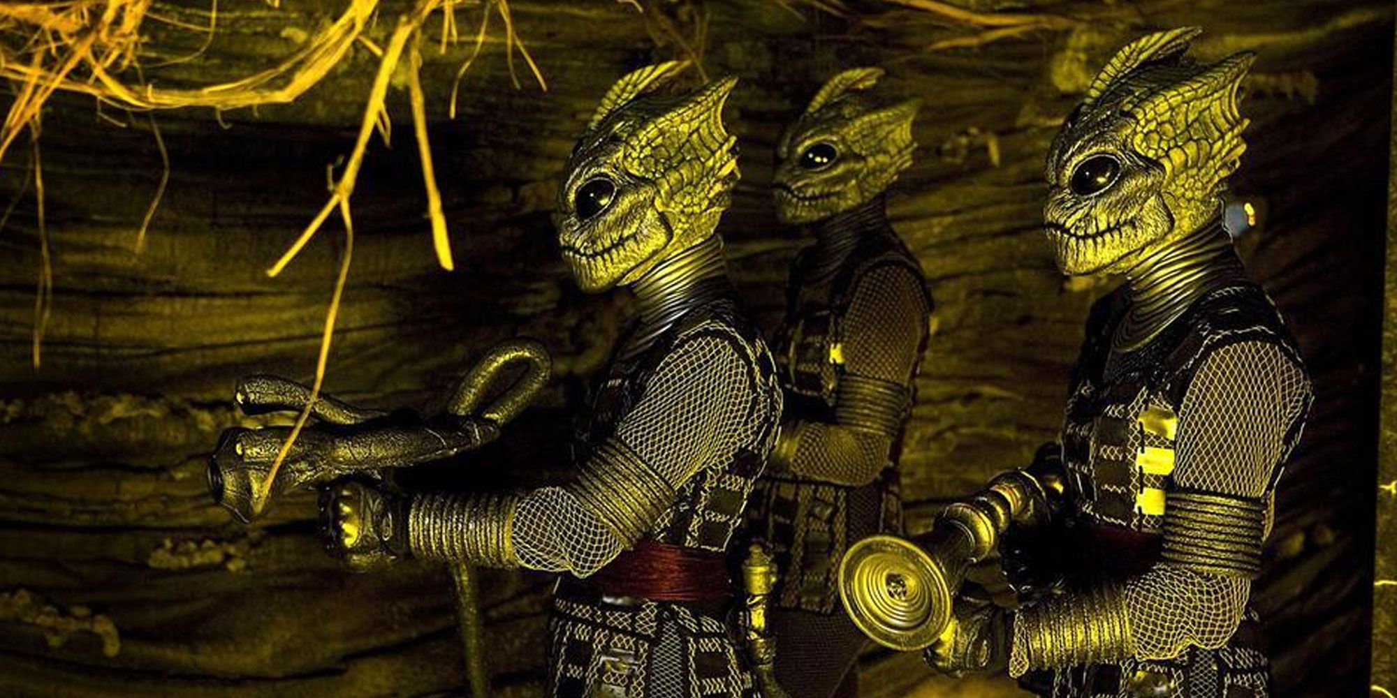 The Silurians pointing their weapons to the left in Doctor Who Cold Blood