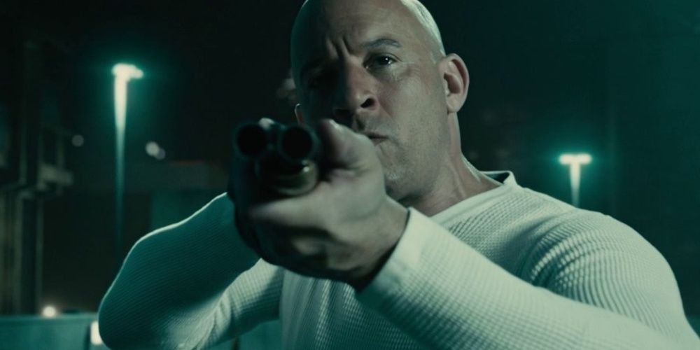 Dominic Toretto aiming a gun in Furious 7 