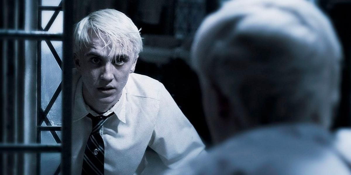 Draco Malfoy staring at the mirror
