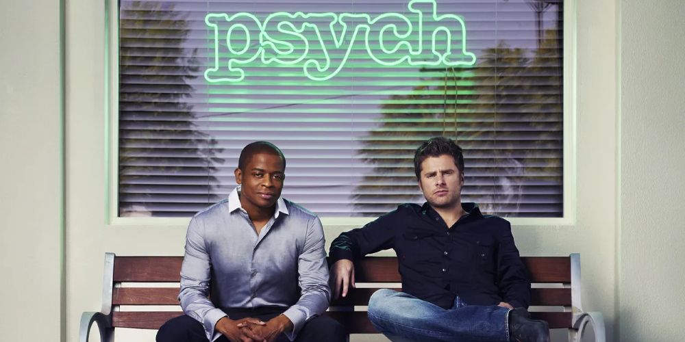 Shawn and Burton sit on a bench together in promo for Psych